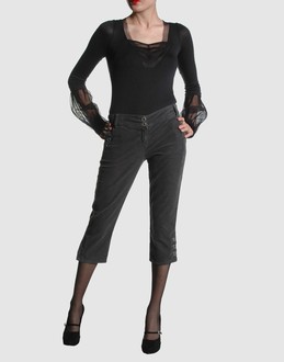Velveteen - Stretch - Low waisted - Button, zip fly closure - Four pockets - Tapering leg cut - Logo details - Strap detailing -