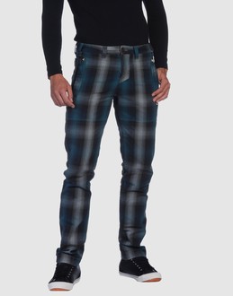 Plaid - Belt loops - Button, zip fly closure - Four pockets - Straight leg cut - Studs - Pleated detailing - Stitch detailing -
