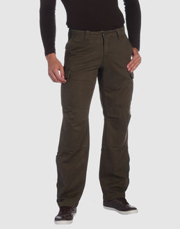 Gabardine - Belt loops - Button, zip fly closure - Multipockets - Zip closing hemline - Boning -