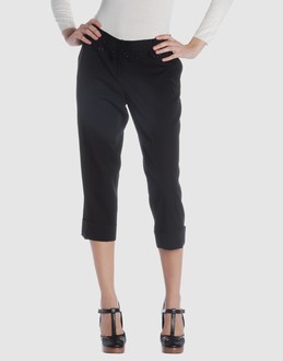 Wool voile - Low waisted - Button, zip fly closure - Four pockets - Tapering leg cut - Cuffed hems - Contrasting applications - Stitch detailing -