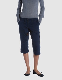 Gabardine - Belt loops - Button, zip fly closure - Five pockets - Zip closing hemline - Rear logo - Contrasting applications - Strap detailing -
