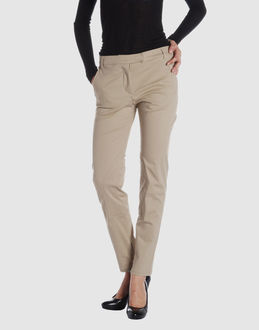 Gabardine - High-rise waistline - Hook-and-bar, zip fly closure - Two front pockets - Tapering leg cut - Zip closing hemline - Stitch detailing -