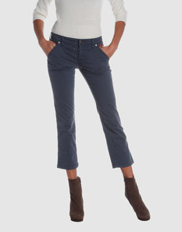 Gabardine - Stretch - Belt loops - Snap-button, zip fly closure - Four pockets - Cropped leg cut - Contrasting applications - Studs - Rear logo -