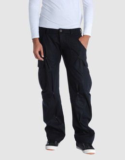 Woollen cloth - Belt loops - Button, zip fly closure - Multipockets - Contrasting applications -