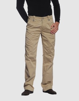 Gabardine - Belt loops - Snap-button, zip fly closure - Three pockets - Straight leg cut - Contrasting applications - Rear logo - Raw cut -