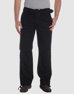 Woollen cloth - Belt loops - Button, zip fly closure - Four pockets - Straight leg cut - Drawstring hemline - Belt attachment -
