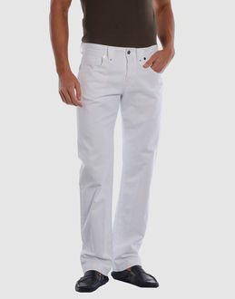 Gabardine - Belt loops - Hidden buttons - Five pockets - Studs - Embroidered logo -