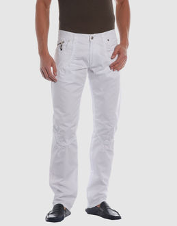 Cloth - Belt loops - Button, zip fly closure - Five pockets - Rear logo - Stitch detailing - Studs -