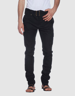 Canvas - Belt loops - Hook-and-bar, zip fly closure - Multipockets - Unfinished hems - Belt attachment -