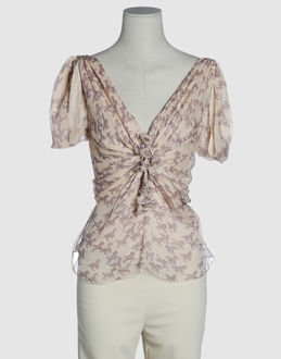 Chiffon - Crepe - V-neckline - Hook-and-bar, zip fly closure - Unfinished hems - Lined interior - Frills - Shoe-string laces -