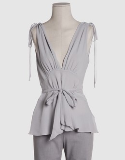Chiffon - Crepe - V-neckline - Zip closure - Lined interior - Shoe-string laces - Frills -