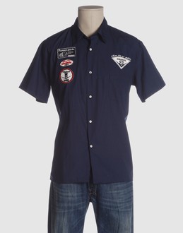 Cloth - Single external pocket - Button closing - Side slit hemline - Logo print - Pleated detailing - Embroidery -