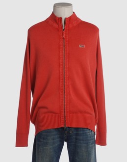 Light-weight knit - Finely ribbed jersey - Mock neckline - Zip closure - Embroidered logo - Contrasting applications -