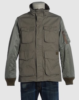 Cloth - Techno fabric - Fur trimmed collar - Multipockets - Snap-button, zip fly closure - Fur interior - Logo details - Stitch detailing -