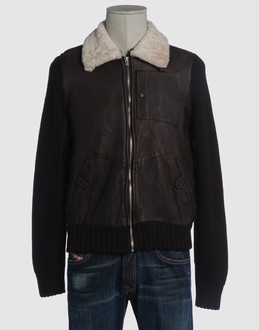 Leather - Ribbed jersey - Fur trimmed collar - Three pockets - Zip closure - Strap detailing -