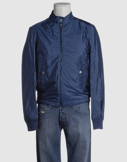 Techno fabric - Two pockets - Two internal jacket pockets - Snap-button, zip fly closure - Studs - Stitch detailing -