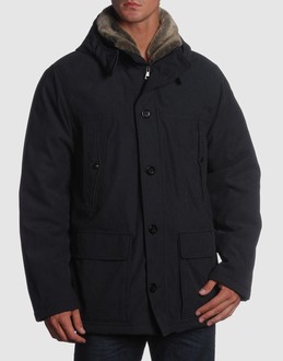 Fur - Techno fabric - Hooded neckline - Four pockets - One internal jacket pocket - Button, zip fly closure - Padded interior - Stitch detailing - Contrasting interior - Logo details -
