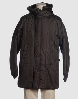 Techno fabric - Double-layer - Hooded neckline - Two pockets - One internal jacket pocket - Snap-button, zip fly closure - Padded interior - Strap detailing -