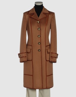 Wool velour - Nappa leather - Strapped cuffs - Two pockets - 6 buttons - Lined interior - Contrasting applications -