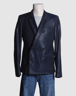 Wool voile - Satin - Four pockets - Three internal jacket pockets - Double-breasted closure - Partially lined interior - Contrasting applications -