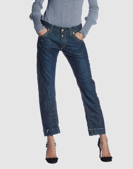 Denim cotton - Belt loops - Button closing - Four pockets - Tapering leg cut - Rear logo -