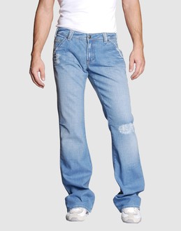 Denim cotton - Stretch - Belt loops - Button, zip fly closure - Five pockets - Bootleg cut - Slashed detailing - Rear logo - Studs -