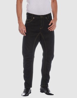 Denim cotton - Belt loops - Button, zip fly closure - Five pockets - Tapering leg cut - Studs - Contrast stitched detailing - Rear logo -