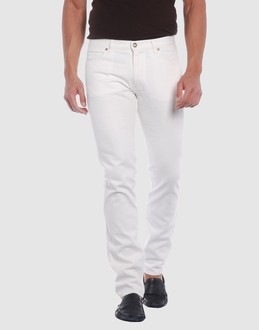 Denim cotton - Belt loops - Button, zip fly closure - Five pockets - Straight leg cut - Studs - Logo details -
