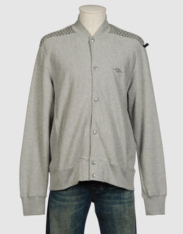 UNRIVALED THE MOST ANARCHIC - SWEATS - Sweatshirts - sur YOOX.COM-Effet mélangée Fermeture avec boutons-pressions Deux poches Impression Logo Molletonné Tissé 100% coton