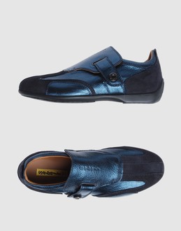 Textured leather - Strap closure - Rubber sole - Logo details - Contrasting applications details -