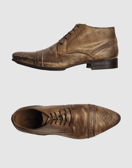 Perforated leather - Laced closure - Leather sole - Stitch detailing - Padding details - Aged-looking leather -