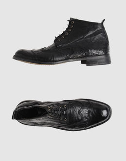 Textured leather - Laced closure - Leather/rubber sole - Stitch detailing - Contrasting applications details - Aged-looking leather -