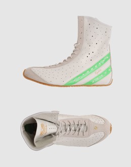 Perforated leather - Suede - Laced closure - Rubber sole - Self-tie - Logo details -