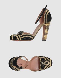 Alaia Closed Toe Slip Ons