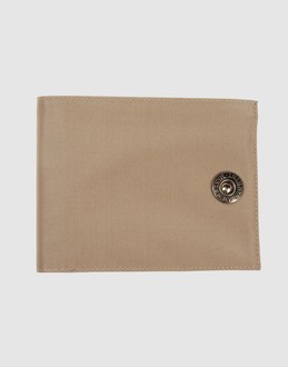 Techno fabric - Internal pockets - Snap button closure - Embossed logo detailing -